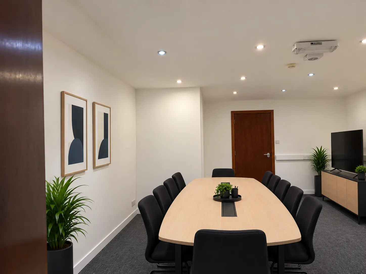 Boardroom table and seating viewed from the doorway at River House